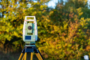 Surveyor equipment (theodolit or total positioning station) on the construction site of the...