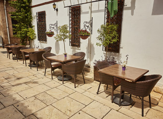 street cafe with wooden chairs and tables