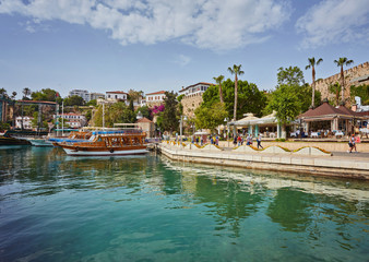 Fototapeta premium Aerial view of yacht harbor and red house roofs in Old town timelapse Antalya, Turkey.