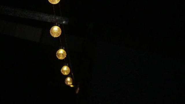 Close up beautiful lights in dark night soft focus effect city evening street background illumination lamp shine bright abstract artistic attractions backlight decor slow motion