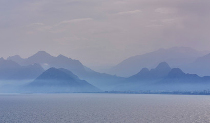 View of the sea from the resort town of Kemer, Antalya, Turkey. Sunset over the Taurus mountains.