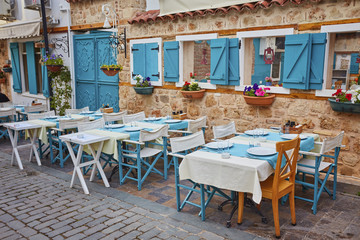 street cafe with wooden chairs and tables