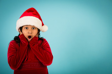 Shocked Christmas Girl Wearing Santa Hat, Room for Text
