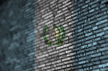 Guatemala flag  is depicted on the screen with the program code. The concept of modern technology and site development