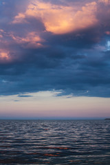 Naklejka na ściany i meble View of beautiful clouds in the evening at sunset from the sea s