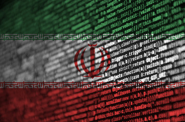 Iran flag  is depicted on the screen with the program code. The concept of modern technology and...