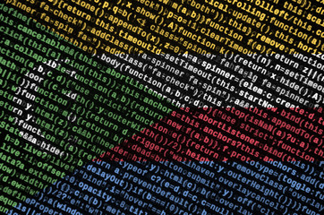 Comoros flag  is depicted on the screen with the program code. The concept of modern technology and...