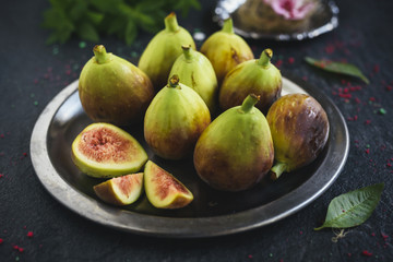 Raw figs served in the metal plate,selective focus