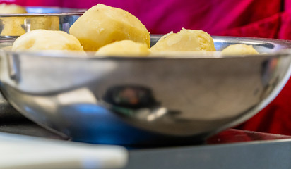 Stainless Steel Bowl with Peeled Potatoes