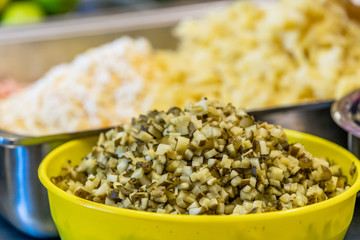 Chopped Ingredients for Salads in Metal Container and Bowl on the Table