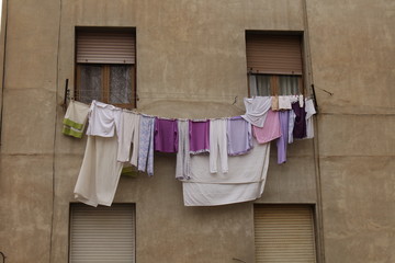 purple clothes hanging on clothesline