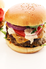 Tasty fresh meat burgers with salad and cheese. Homemade angus burger.