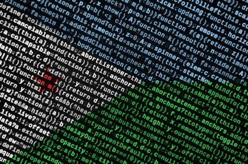 Djibouti flag  is depicted on the screen with the program code. The concept of modern technology...