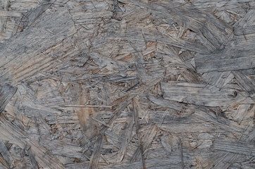 Weathered and faded particle board