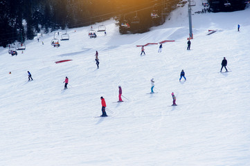 Ski resort. Downhill view. Downhill skiing people.