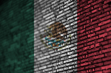 Mexico flag  is depicted on the screen with the program code. The concept of modern technology and...