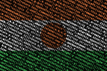 Niger flag  is depicted on the screen with the program code. The concept of modern technology and...