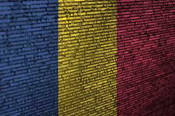 Chad flag  is depicted on the screen with the program code. The concept of modern technology and...
