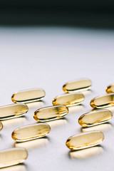 Fish oil capsules on gray background