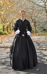 Fototapeta premium Victorian woman in autumn scene