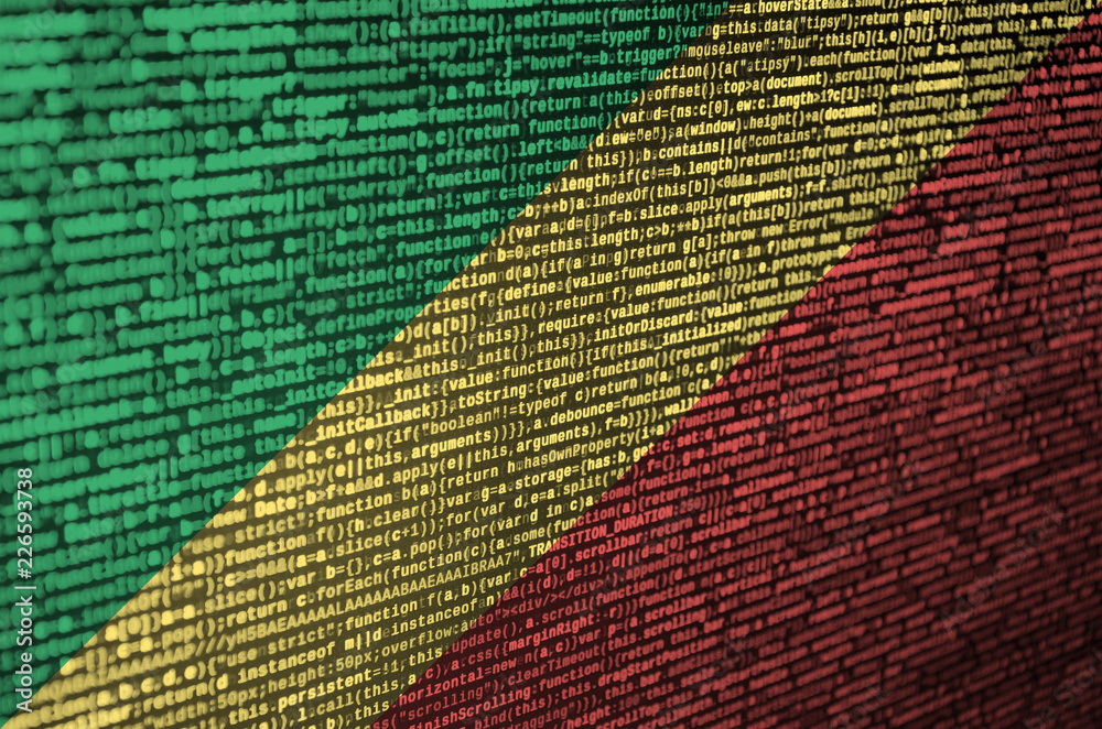 Wall mural congo flag is depicted on the screen with the program code. the concept of modern technology and sit