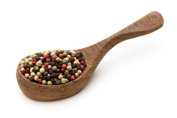 Pepper mix seed on spoon on white background.