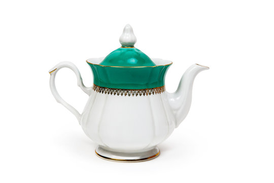 White and green teapot on white background. Isolated on white