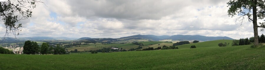 Fototapeta na wymiar south panorama with Kralovsky Sneznik mountains in Czech Republic