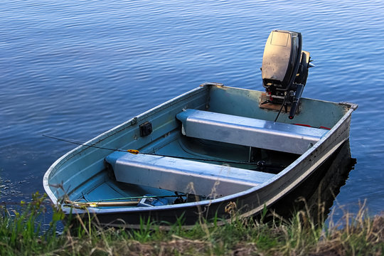 An aluminium fishing boat at the shore