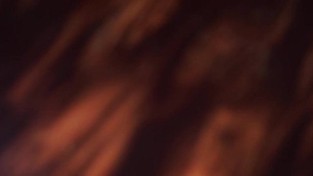 Brown dark background of messy shadows from sunlight through window with spots falling on wooden floor in dark morning room. Real time 4k video footage.