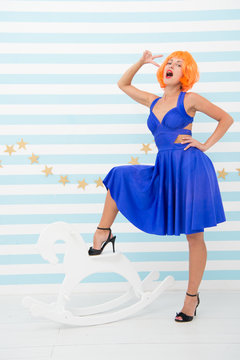 Crazy hipster girl in vintage wear. pinup girl pose for circus advertisement. Hipster girl with crazy look. Horse diva. Vintage that loved by all