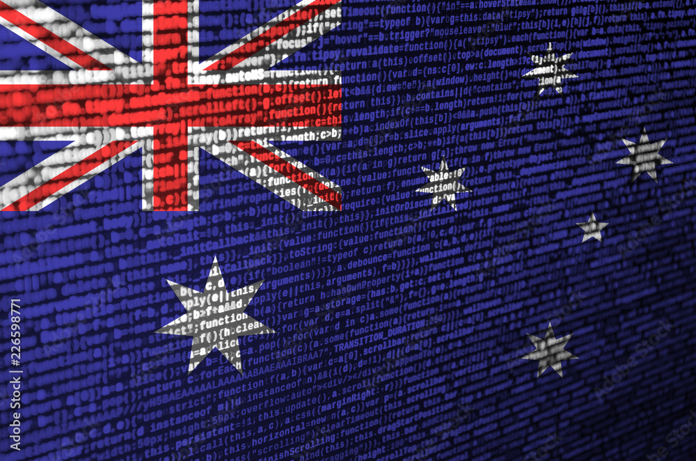 Wall mural australia flag is depicted on the screen with the program code. the concept of modern technology and