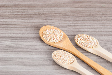 Grains of quinua on wood - Chenopodium quinoa