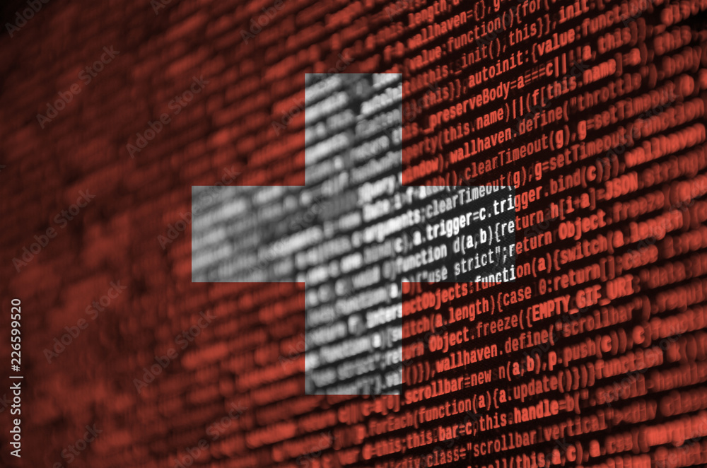 Wall mural switzerland flag is depicted on the screen with the program code. the concept of modern technology a