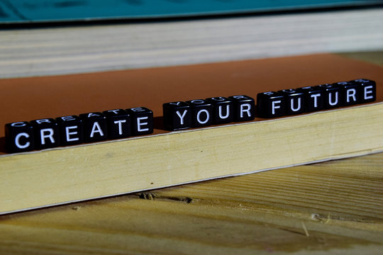 Create your future on wooden blocks. Motivation and inspiration concept. Cross processed image