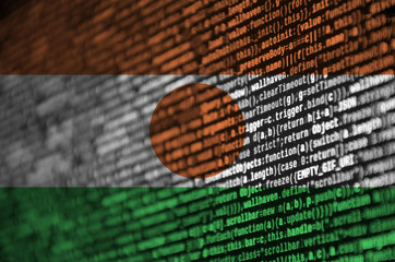 Niger flag  is depicted on the screen with the program code. The concept of modern technology and...
