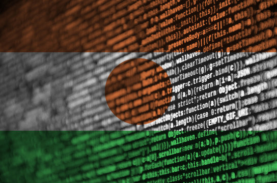 Niger flag is depicted on the screen with the program code. The concept of modern technology and site development - Powered by Adobe