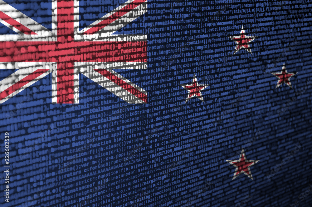 Wall mural new zealand flag is depicted on the screen with the program code. the concept of modern technology a