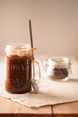 hot chocolate in a tall glass jar.