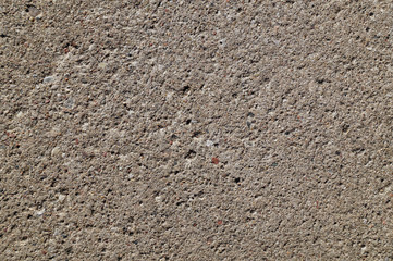 The structure of a concrete wall (slab) consisting of thousands of different grains of sand and gravel.
