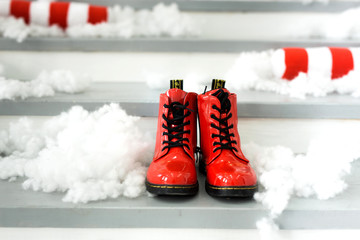 Christmas concept with red shoes. Santa's shoes