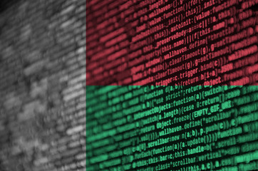 Madagascar flag  is depicted on the screen with the program code. The concept of modern technology...