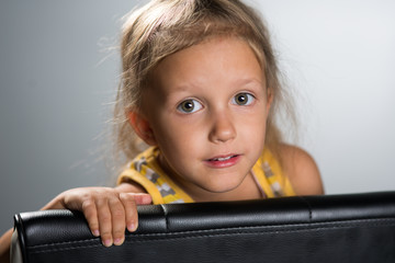 Girl four years on a chair