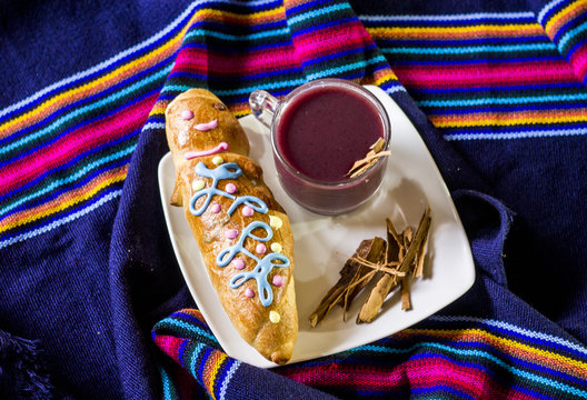 traditional dish and drink Ecuador, called: Colada Morada and bread guaguas