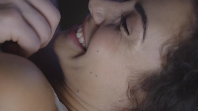 portrait close-up. man and woman are flirting at sunset. man touches woman's nose with his finger. the couple laughs happily.. 4K
