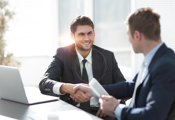 Fototapeta premium close-up.side view.the handshake business partners at your Desk.