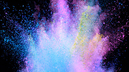 Multi-color powder explosion on black background