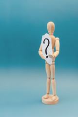 wooden man and question mark