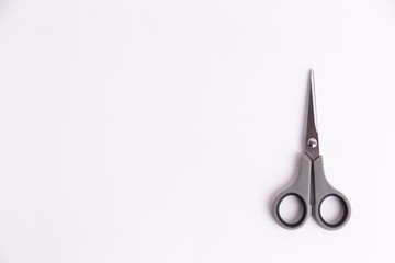 scissors on top of white background