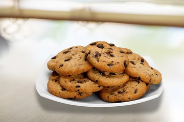 Plate of chocolate chip cookies isolated on